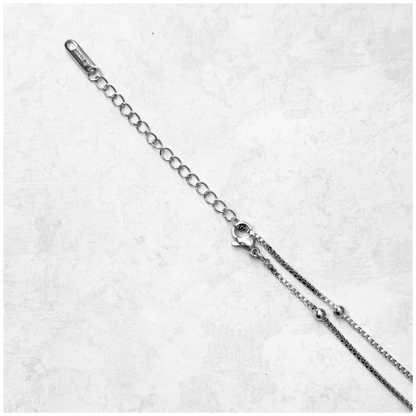 GARGANTILLA CORAZON ESFERA ACERO