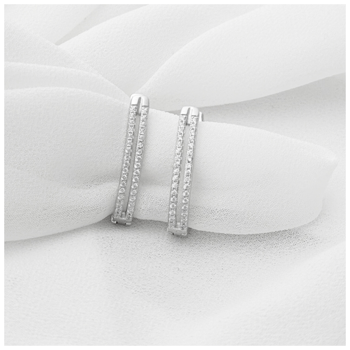 ARETE DOBLE CON CIRCONIA PLATA .925 RODIO