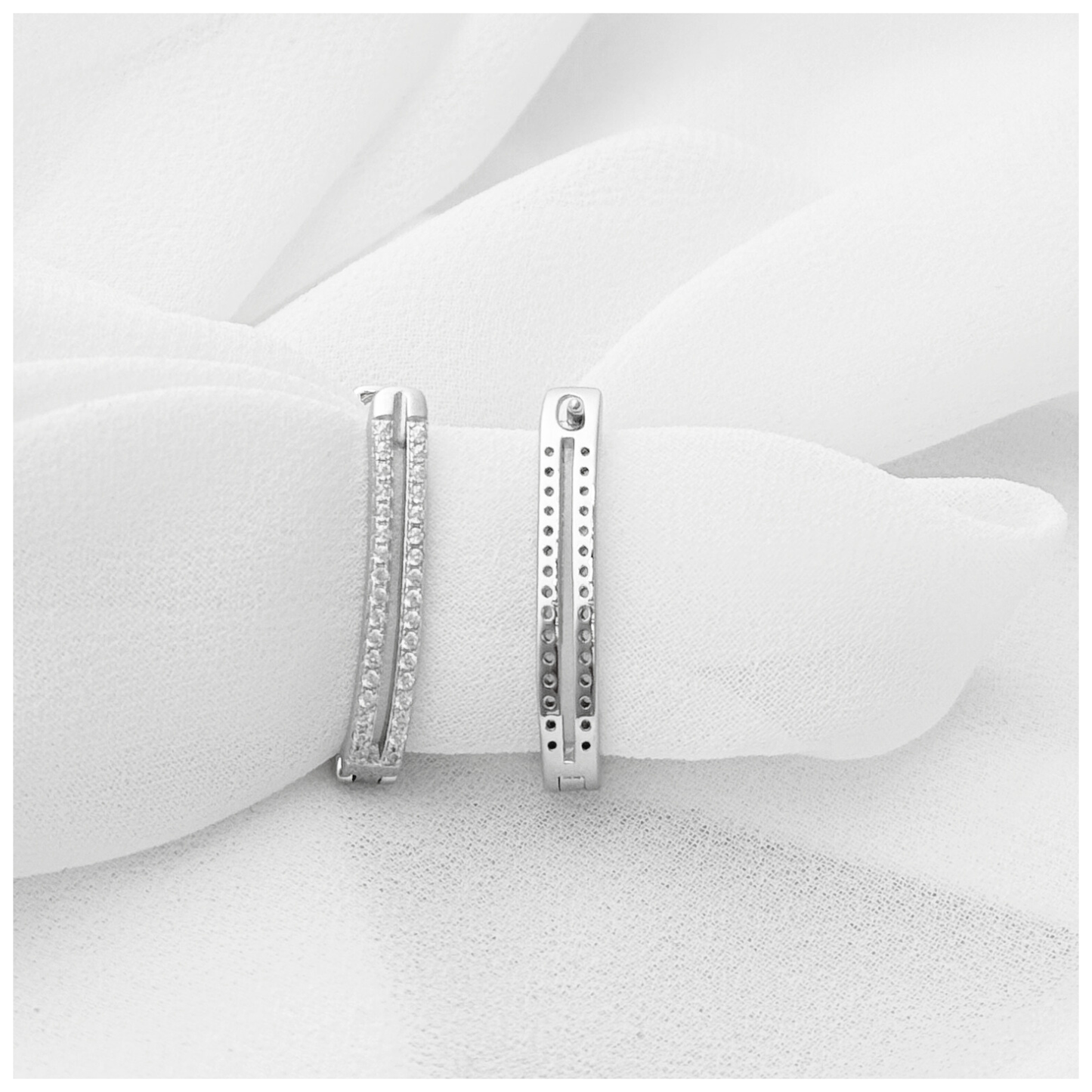 ARETE DOBLE CON CIRCONIA PLATA .925 RODIO