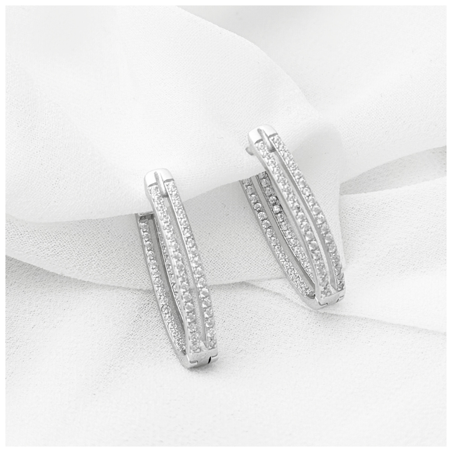 ARETE DOBLE CON CIRCONIA PLATA .925 RODIO