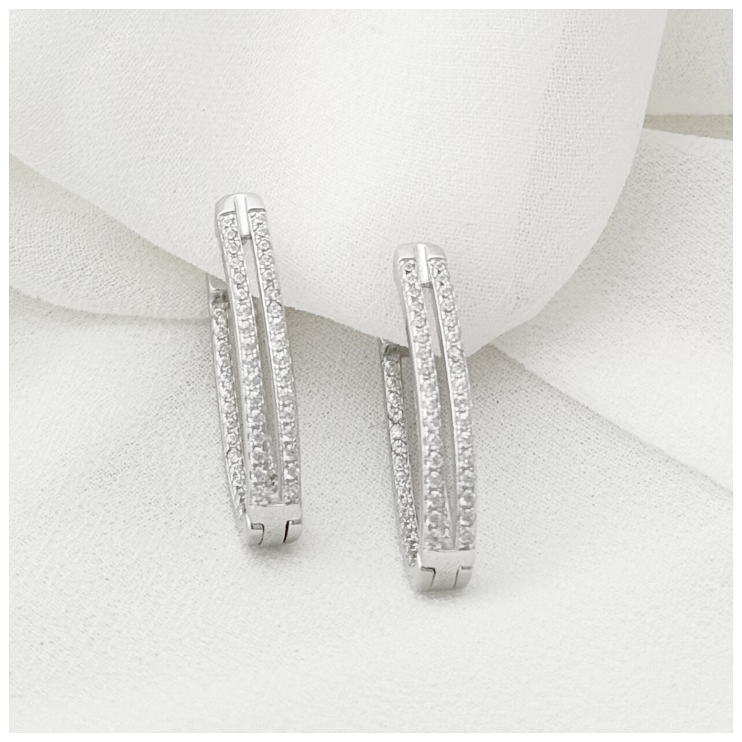 ARETE DOBLE CON CIRCONIA PLATA .925 RODIO