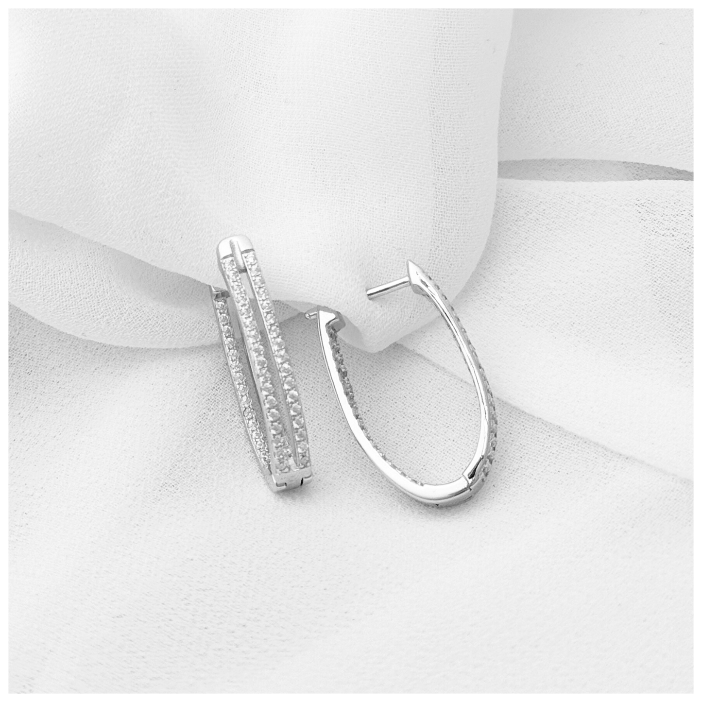 ARETE DOBLE CON CIRCONIA PLATA .925 RODIO