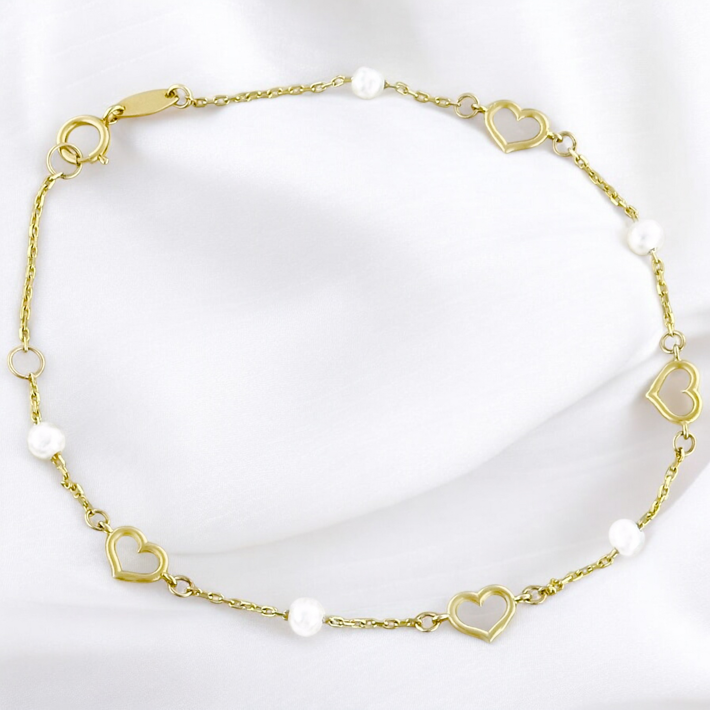 PULSERA CORAZONES PERLAS ORO 10K